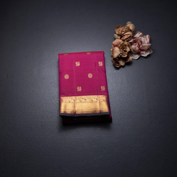 Reddish Pink Silk Saree With Peacock And Chakra Buttas And Gold Zari Border