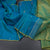 Peacock Blue Borderless Silk Saree With Zari Buttas