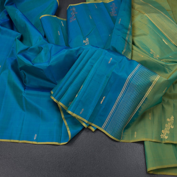 Peacock Blue Borderless Silk Saree With Zari Buttas