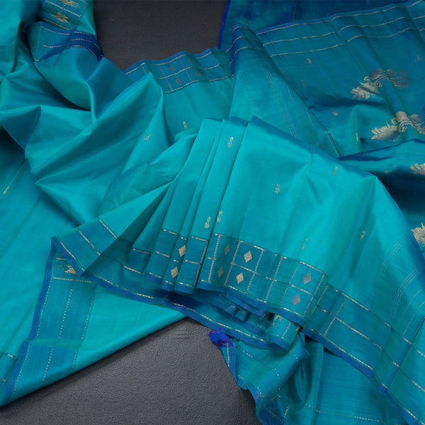 Peacock Blue Silk Saree With Zari Buttas And Zari Checked Border