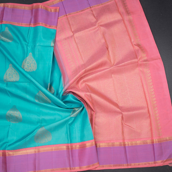 Turquoise Blue Silk Saree With Peacock Design And Thread Border