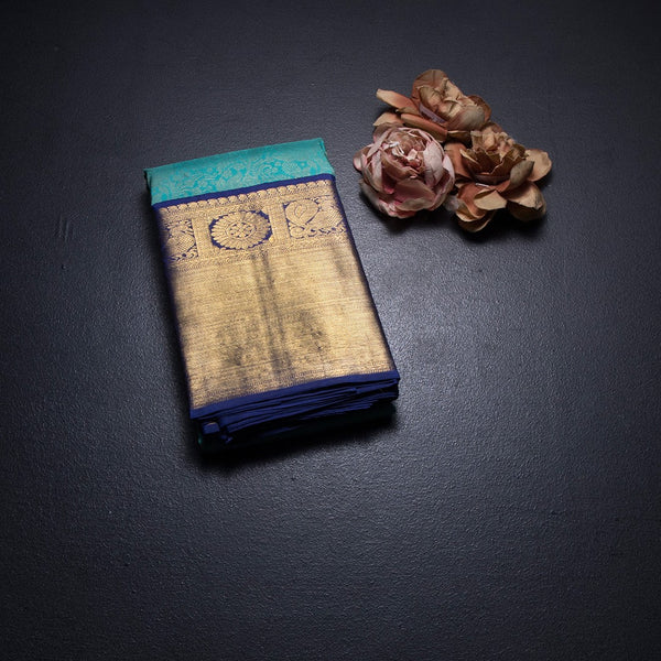 Turquoise Blue Brocade Silk Saree And Gold Zari Border