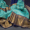 Turquoise Blue Brocade Silk Saree And Gold Zari Border