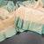 KSSMLSR42234-Cream-Checked-Silk-Saree-With-Peacock-And-Chakra-Buttas-And-Gold-Zari-Border-main