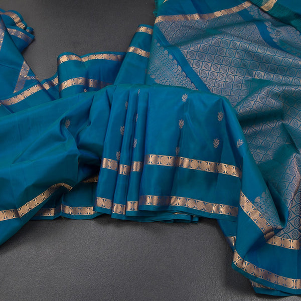 KSSMLSR42482-Peacock-Blue-Silk-Saree-With-Floral-Buttas-And-Rettapet-Border-main