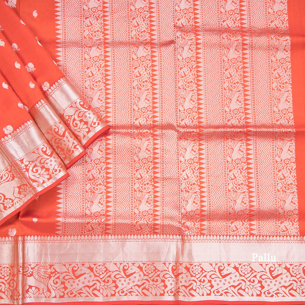 Reddish Orange Soft Silk Saree With Peacock And Mango Buttas In Silver Zari And Animal Motif On Border