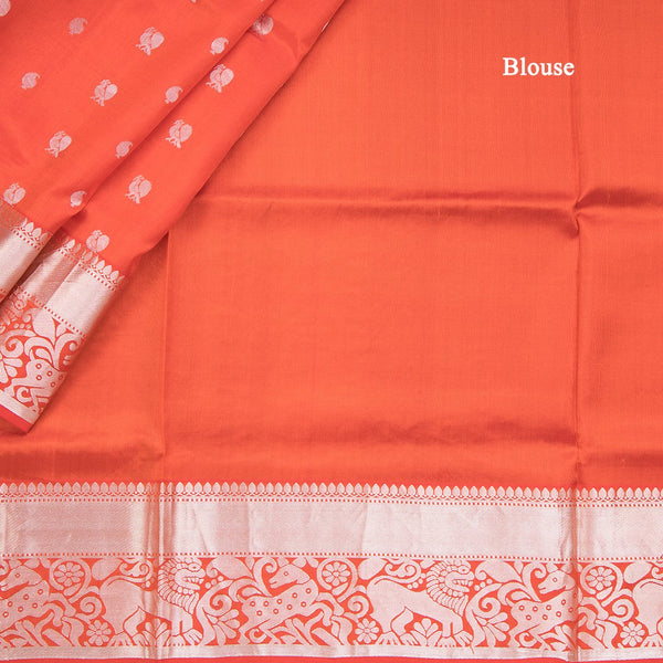 Reddish Orange Soft Silk Saree With Peacock And Mango Buttas In Silver Zari And Animal Motif On Border
