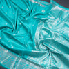 Turquoise Blue Soft Silk Saree With Chakra Buttas And Floral Silver Zari Border