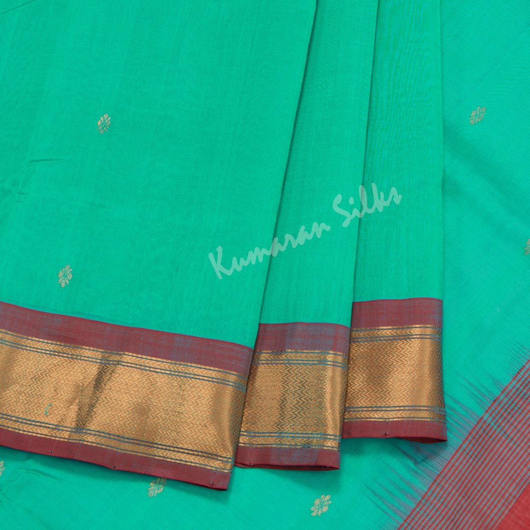Amirthavarshini Silk Cotton Green Saree With Small Buttas