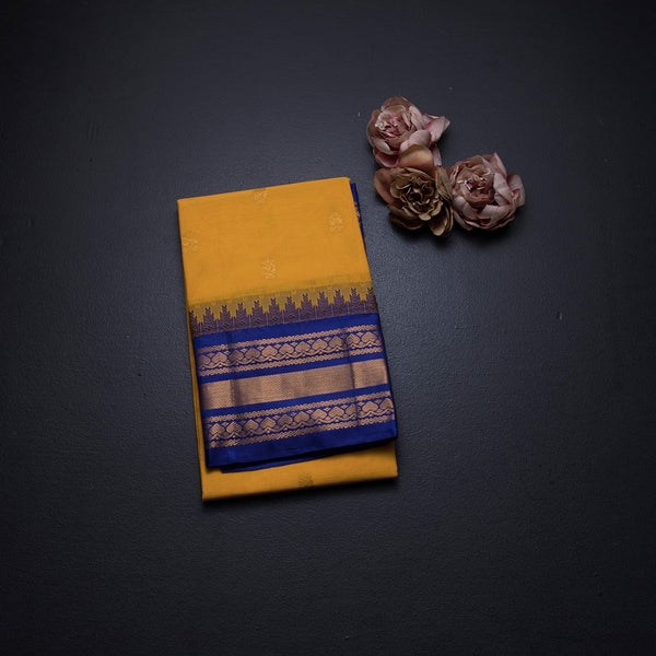 Gadwal Cotton Mango Yellow Saree With Zari Buttas And Temple Border Without Blouse