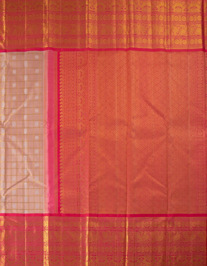 Pink Silk Saree With Peacock And Chakra Buttas On The Body With Yazhi Designed Red Border