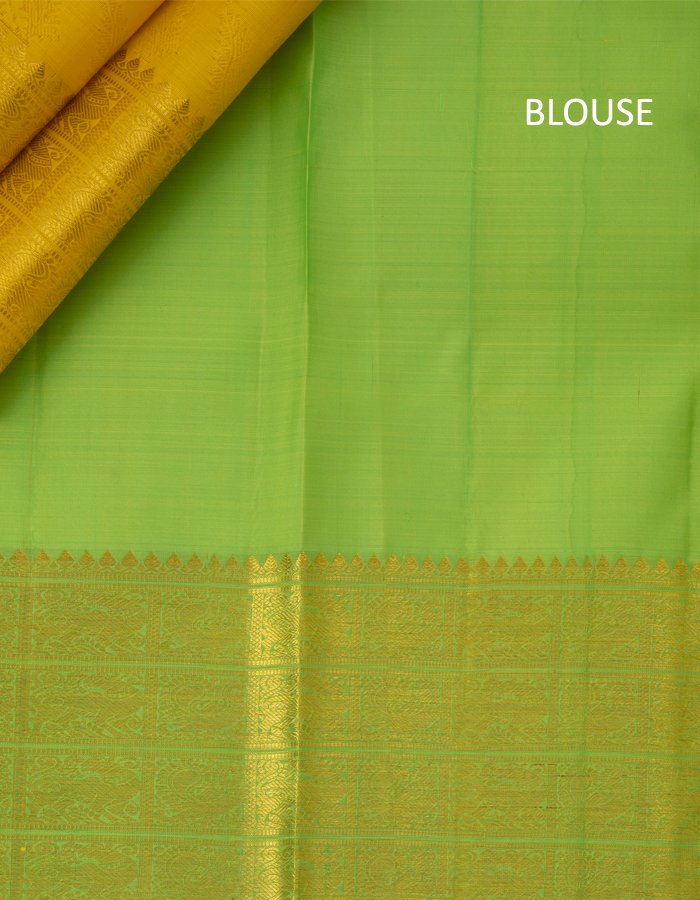 Yellow Brocade Silk Saree With Peacock And Yazhi Designed Border
