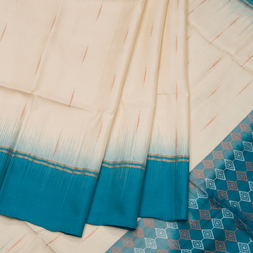 Cream Soft Silk Saree With Rain Drop Zig-Zag Designed Peacock Blue Pallu