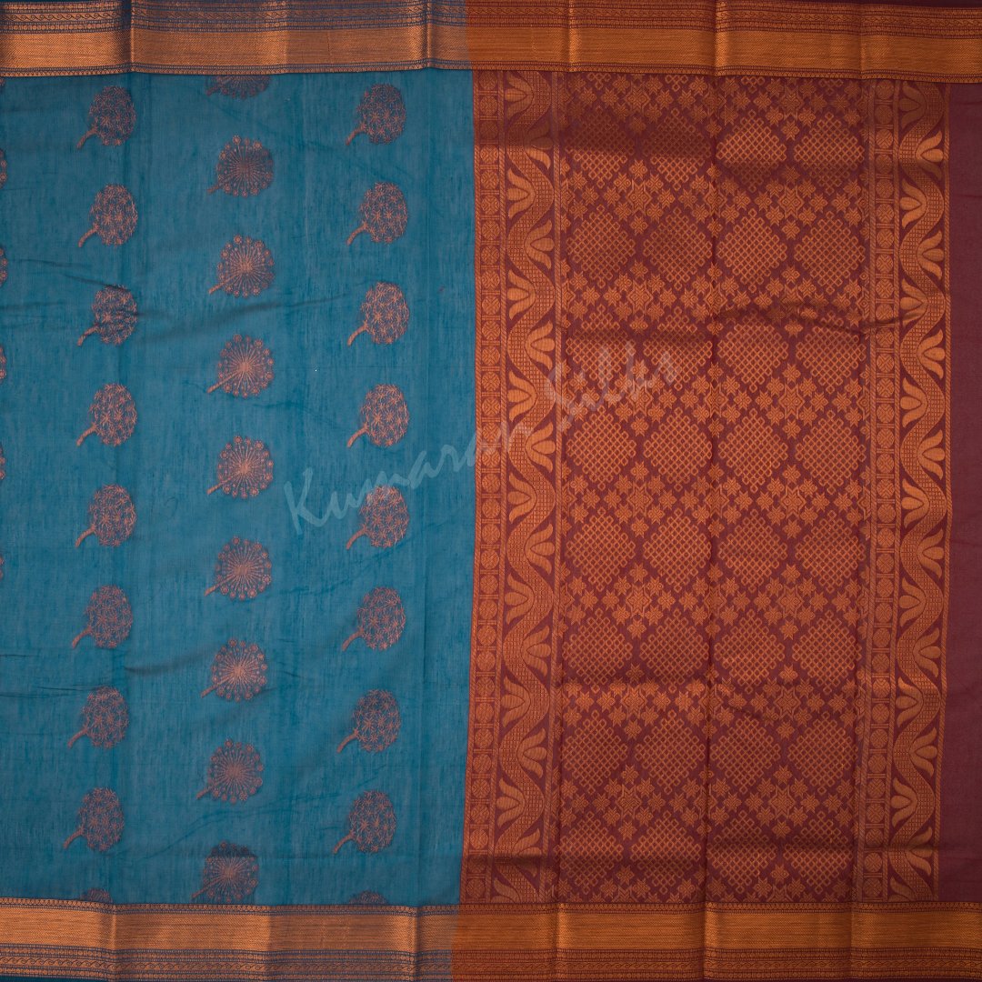 Silk Cotton Peacock Blue Saree With Floral Design On The Body And Zari Border