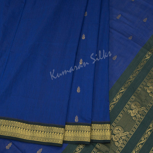 Kalyani Cotton Dark Blue Saree With Small Buttas On The Body And Peacock Motif On The Pallu