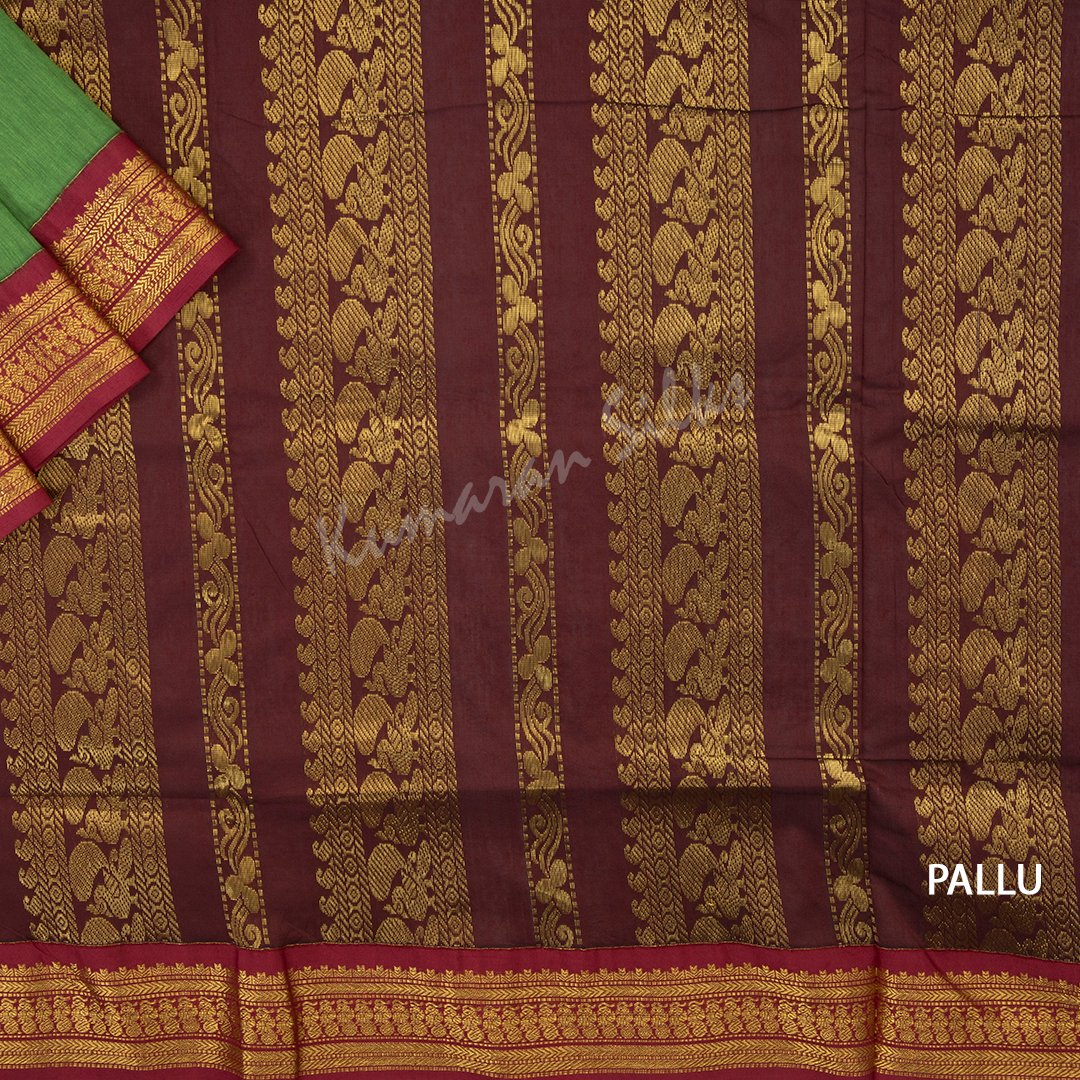 Kalyani Cotton Parrot Green Saree With Small Buttas On The Body And Peacock Motif On The Pallu