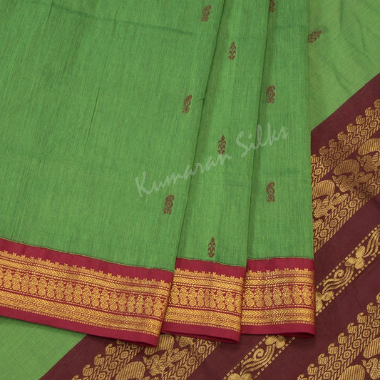 Kalyani Cotton Parrot Green Saree With Small Buttas On The Body And Peacock Motif On The Pallu