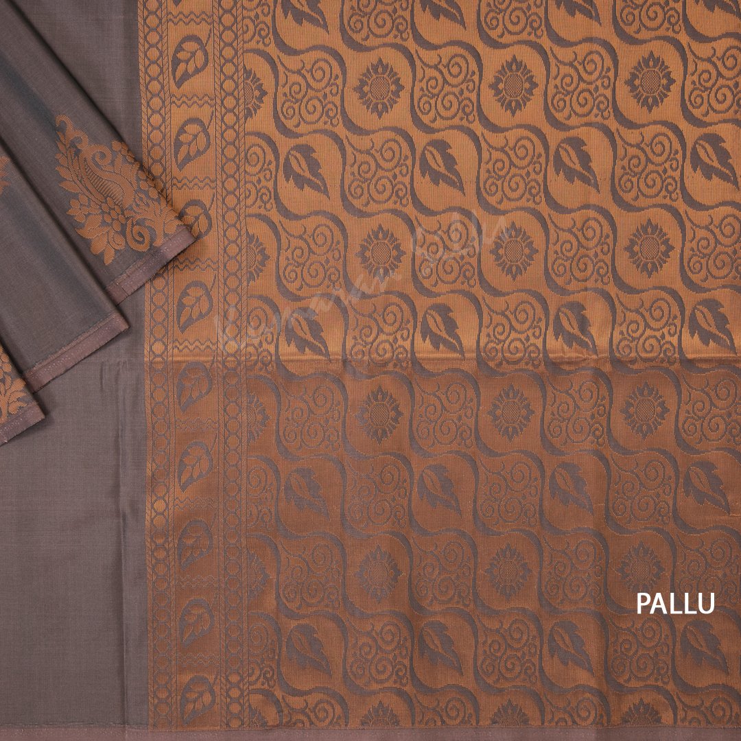 Semi Soft Silk Shot Colour Borderless Saree With Mango Buttas On The Body And Leaf Design On The Pallu